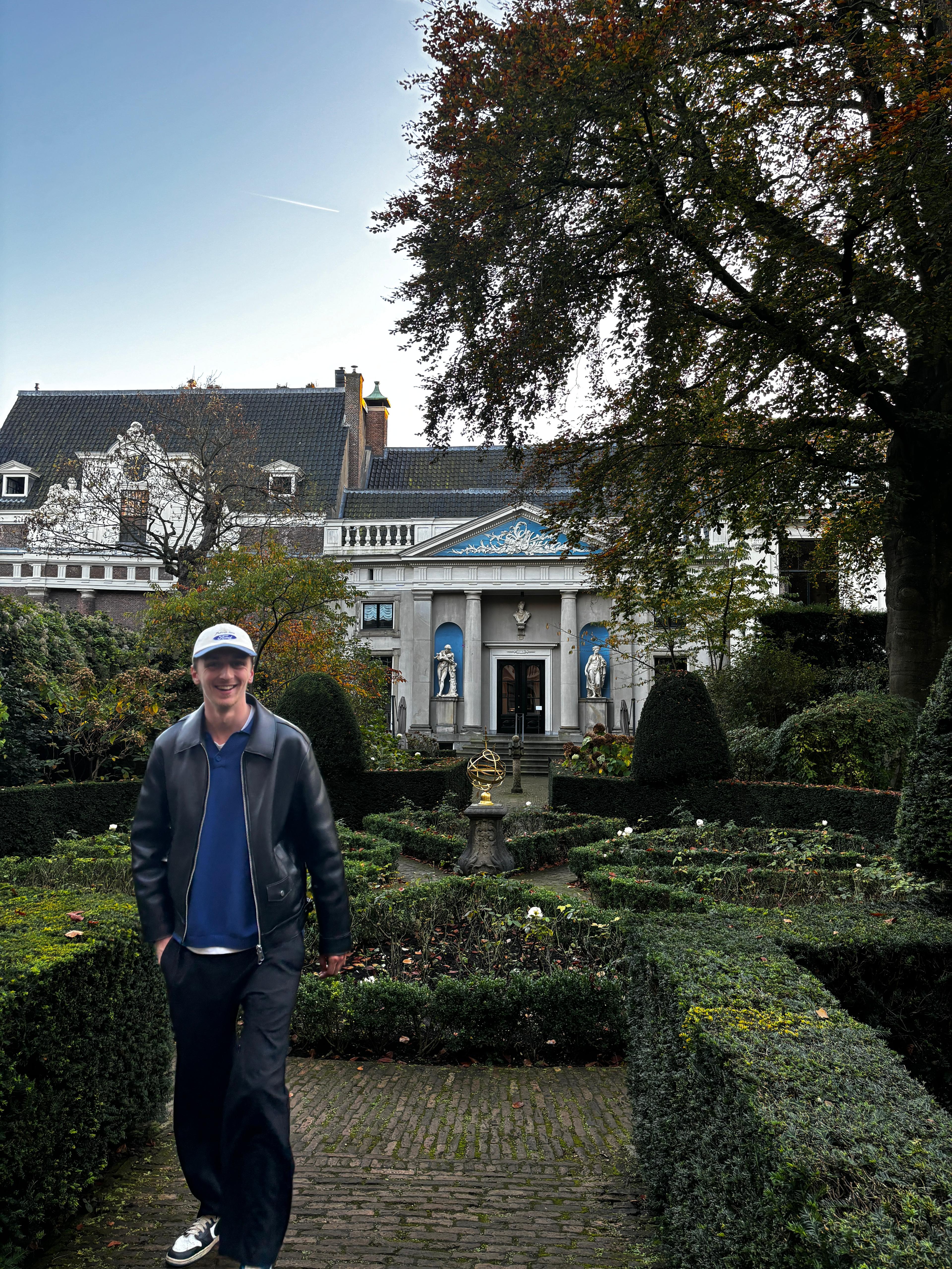 Co-founder, Geert Jan Feenstra smiling while wearing a hat, and wandering through a park